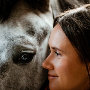 A woman bonding with her horse